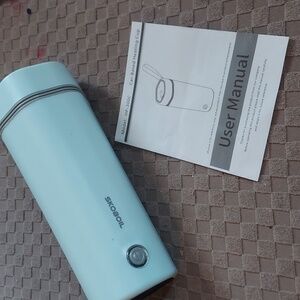 Never used teal car based heating mug